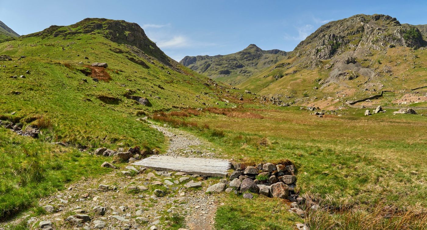 Footbridge along a rocky hiking trail in Grisedale Valley in the Lake District National Park