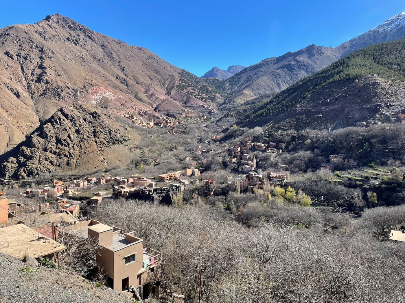 Sprawling cluster of traditional clay-toned villages in the High Atlas region of Morocco.