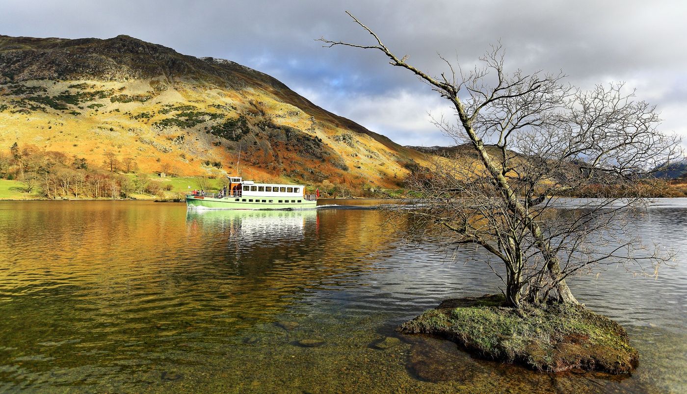Tourist boat cruising the calm waters of Ullswater