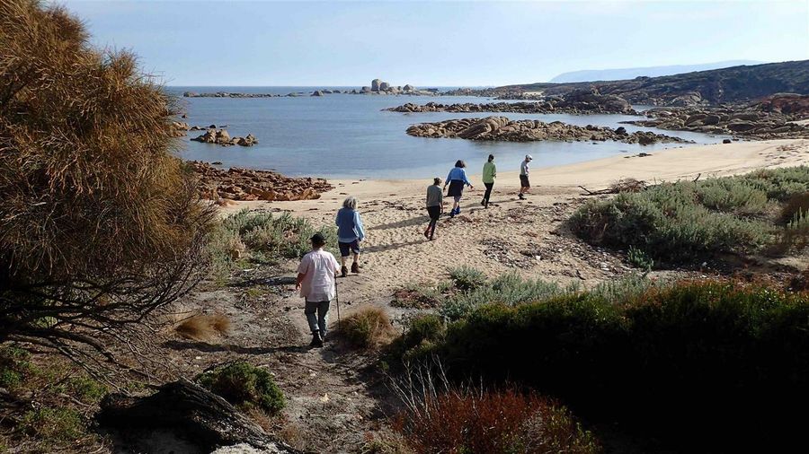 Walkers on Flinders Island beach