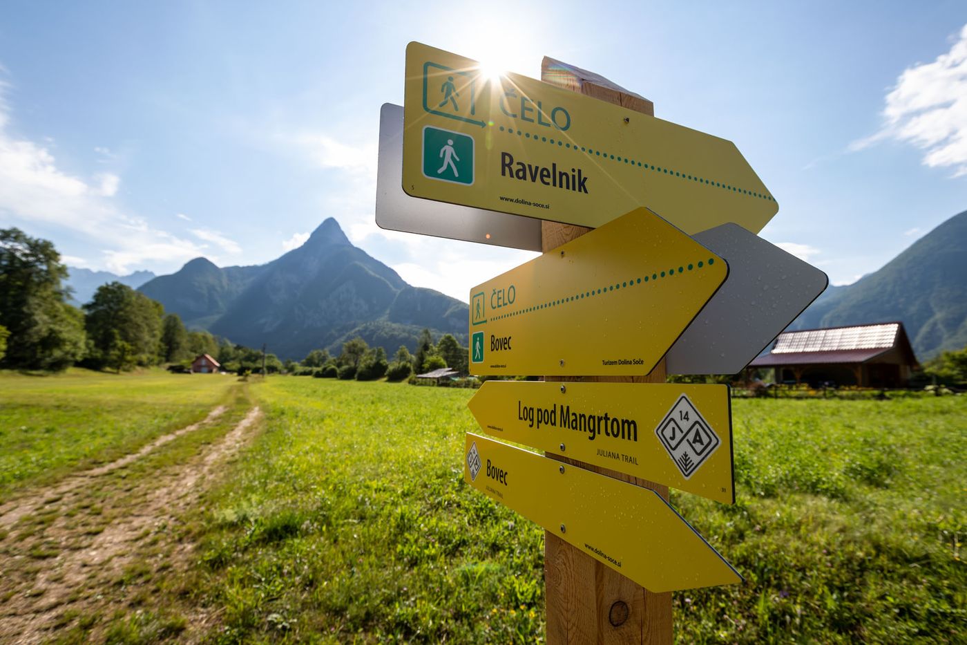 Yellow trail sign marks in bovec-log-pod-mangartom - supplied by Juliana Travels
